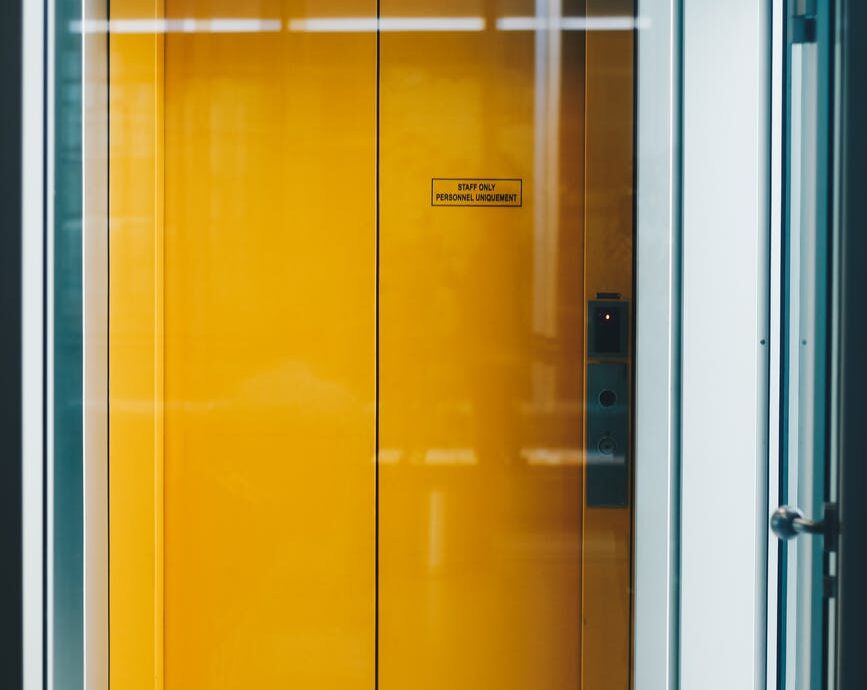 closed yellow elevator door