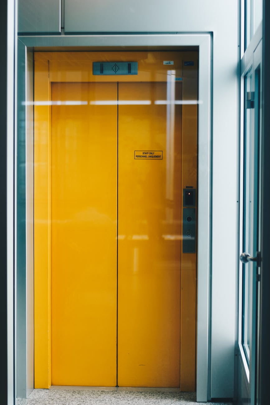 closed yellow elevator door